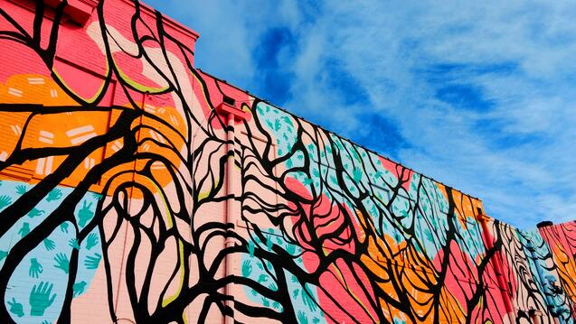 Colorful mural on a wall looking up