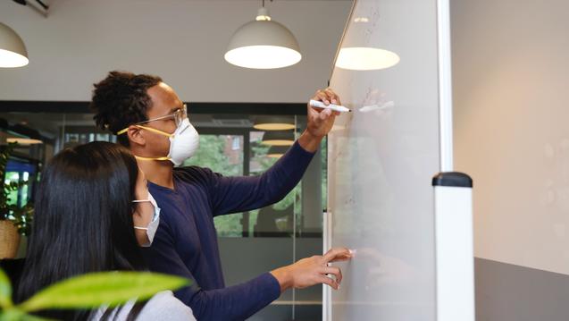 BIPOC People at a white board