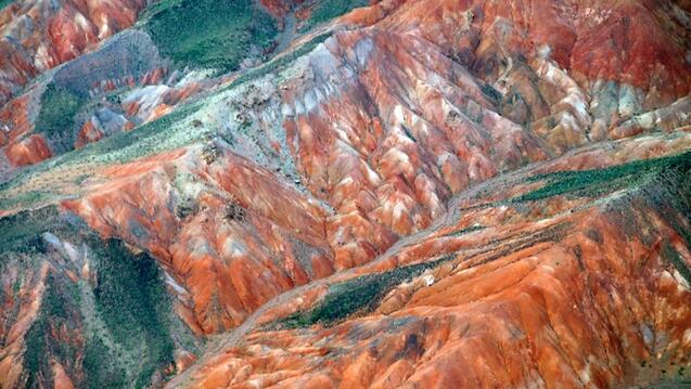 Orange, green and white mountainous region.