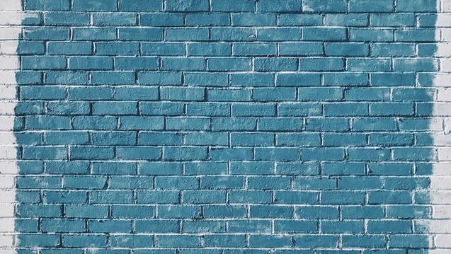 Blue brick wall with white brick border