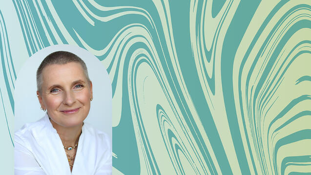 Elizabeth Gilbert color portrait inside the shape of a portal. Elizabeth is smiling, has a shaved head, and is wearing a white top with layers of necklaces.