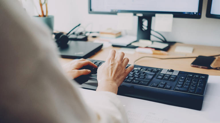 Photo of hands typing on a computer keyboard by Daniel Enders Theiss on Unsplash