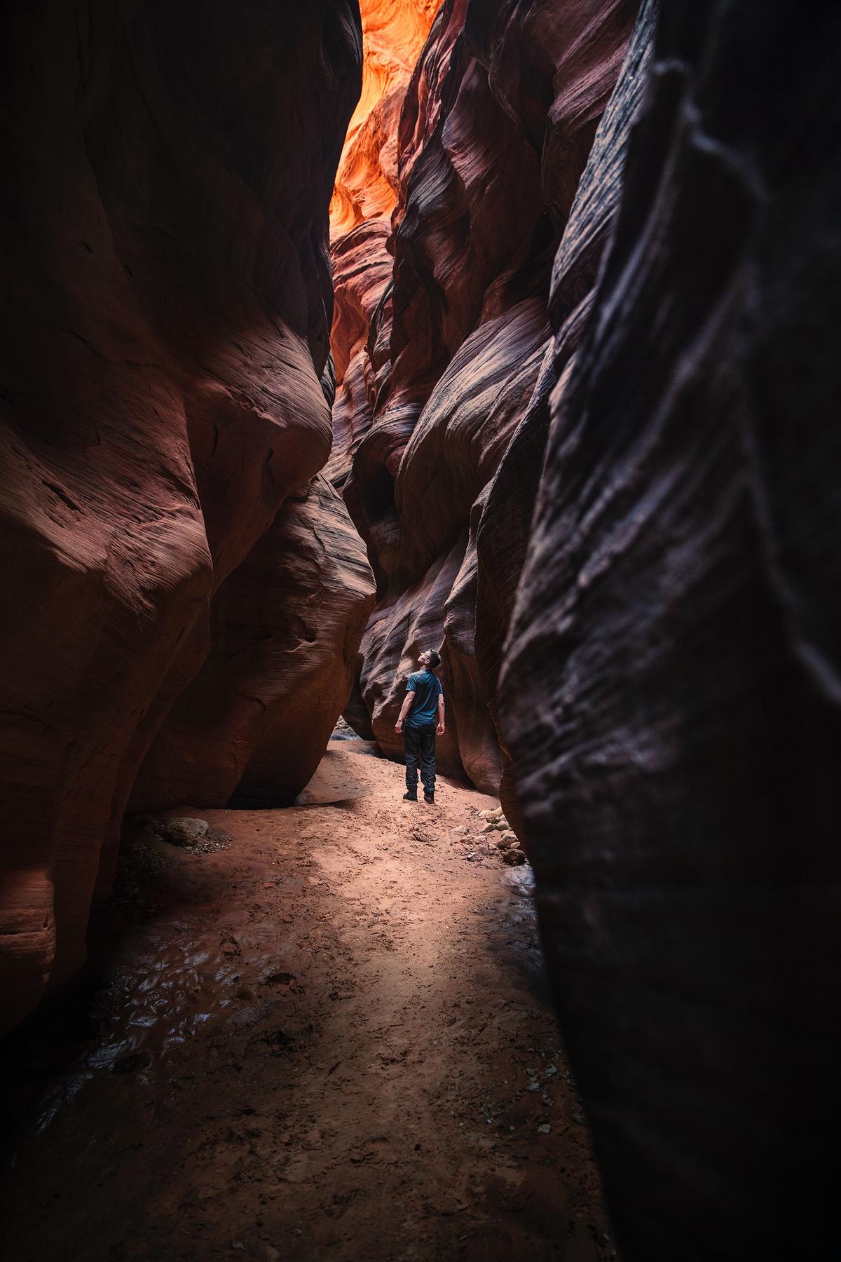 Person standing in a cavern