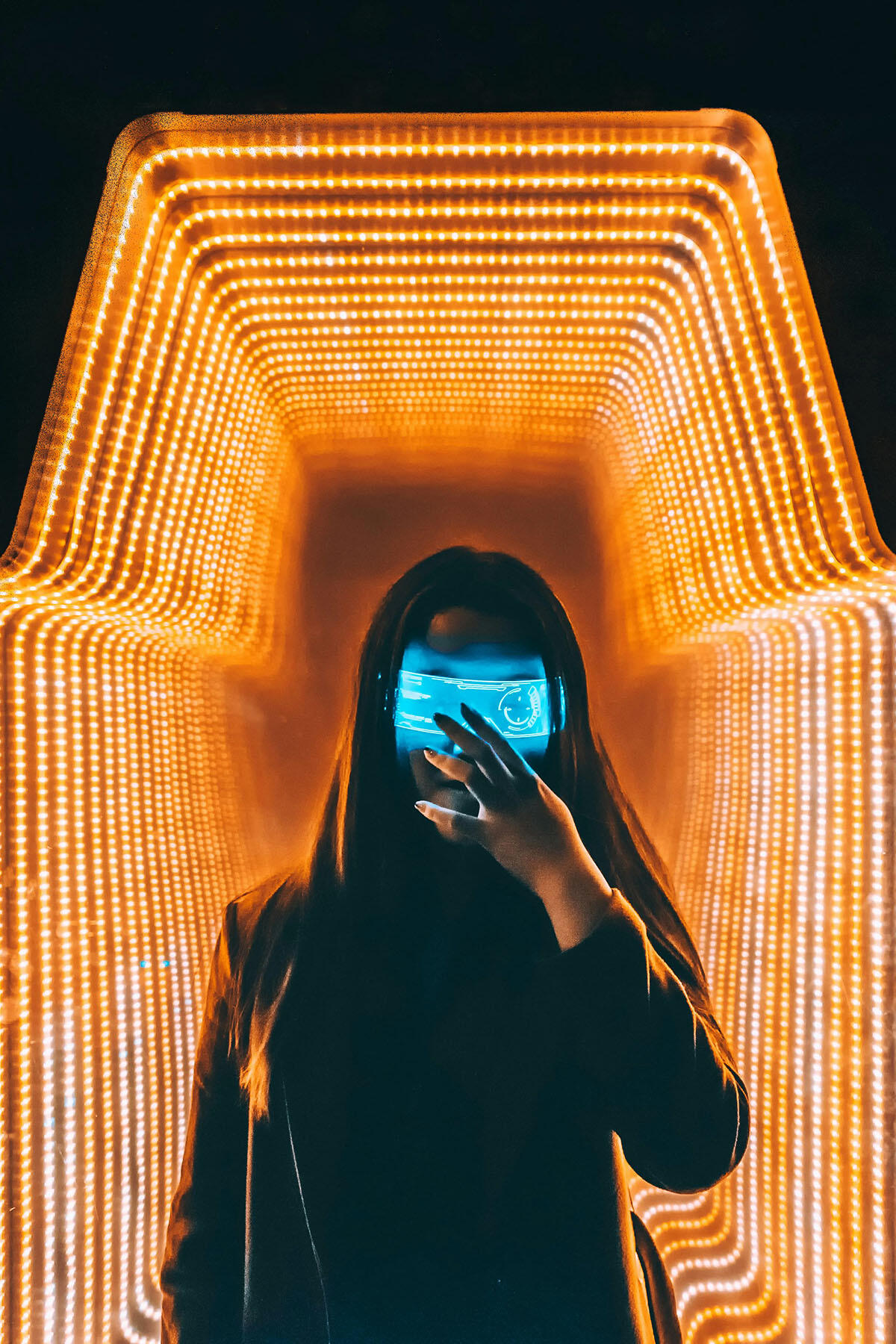 Person in Black Top Inside Orange Lighted Room